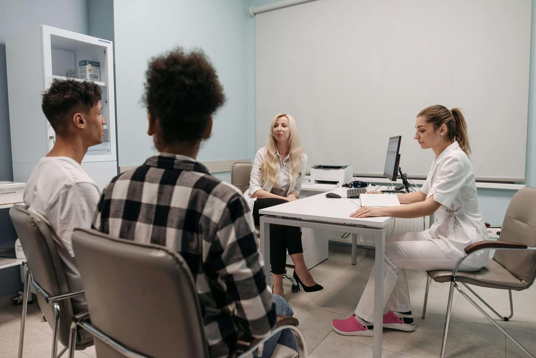 Patients meeting a clinician for a fertility consultation