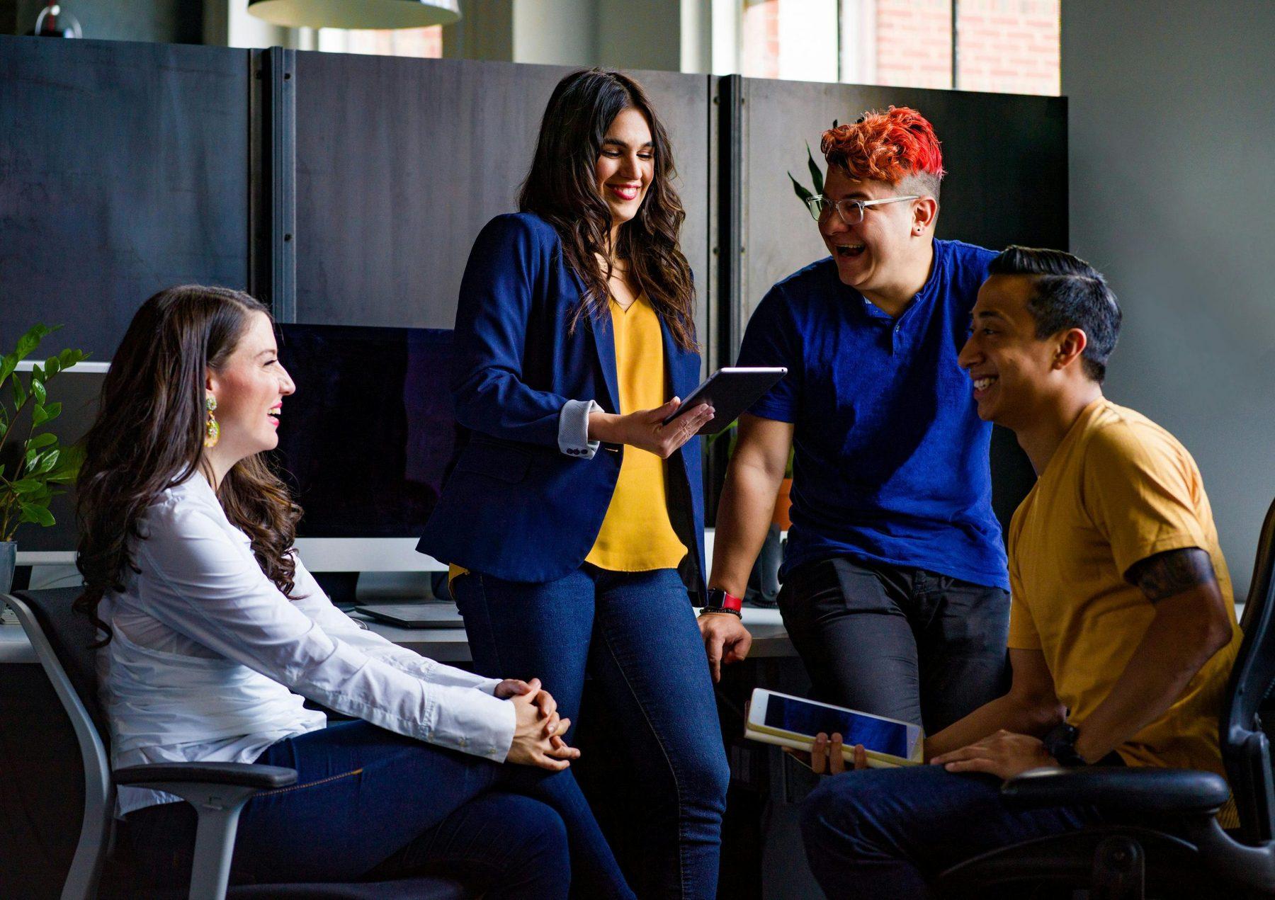 A small team talking together in an office