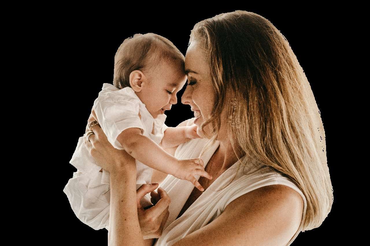 A mother holding her baby close